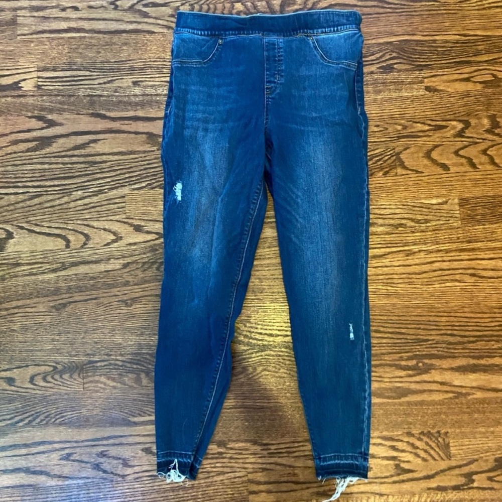 Worn out pair of spanx jeans